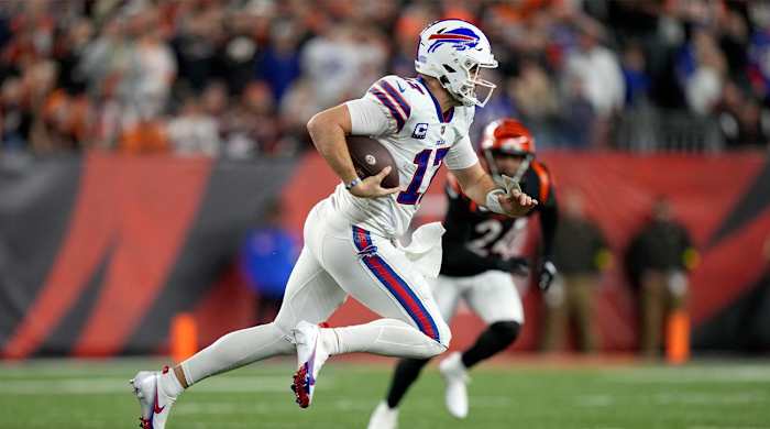 Buffalo Bills quarterback Josh Allen (17) carries the ball in the first quarter of a Week 17 NFL game against the Cincinnati Bengals, Monday, Jan. 2, 2023, at Paycor Stadium in Cincinnati.